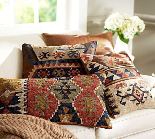 The Art of Layering: Rugs, Pillows, and Throws That Elevate Your Space